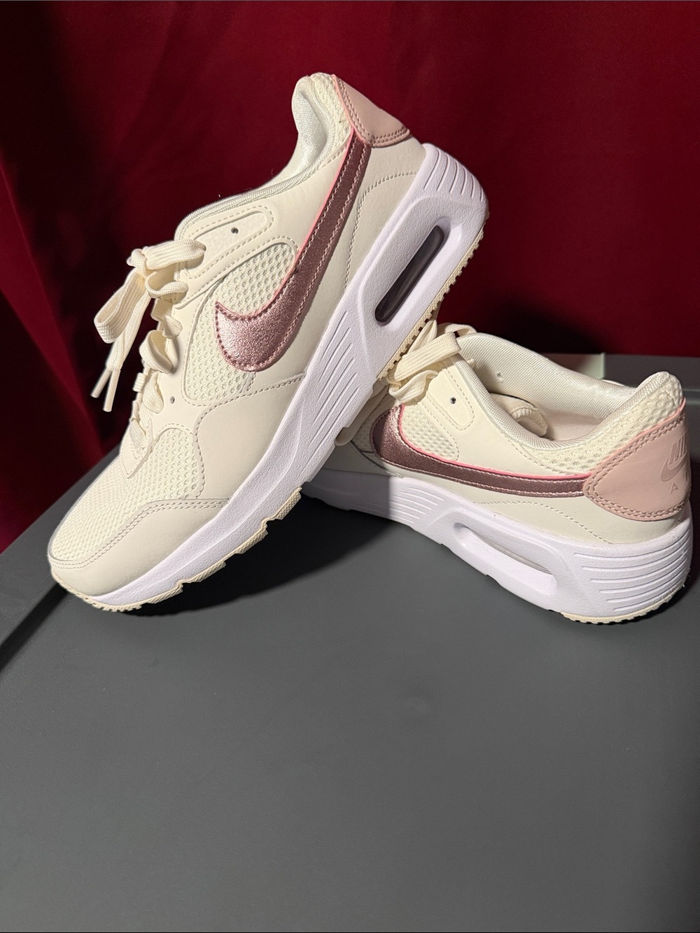 Nike Women’s Cream Sneakers with Pink Metallic Swoosh